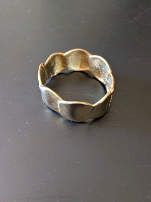 Wide opening bracelet new in gold color made of steel