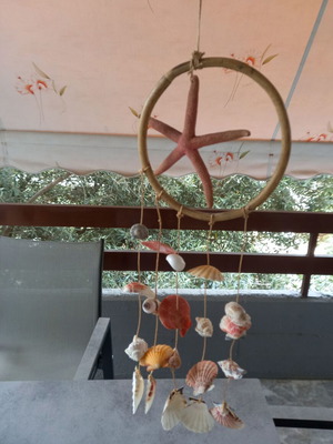 Handmade wind chime with natural shells and starfish like new