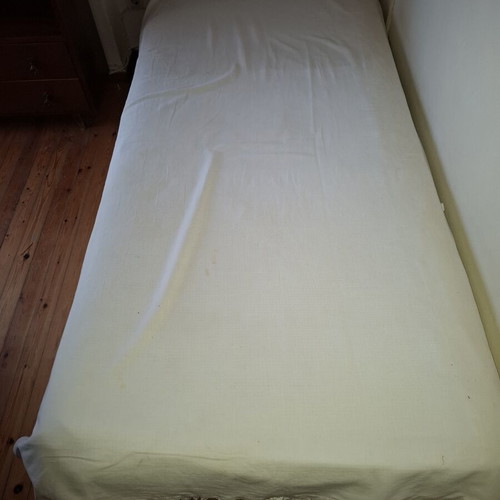 Single bed used with mattress and pillow