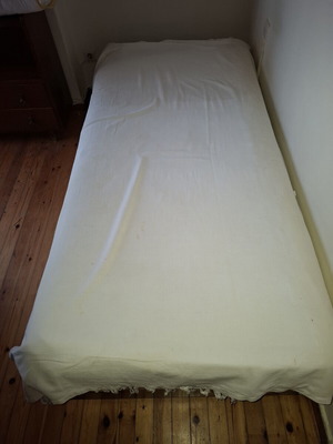 Single bed used with mattress and pillow