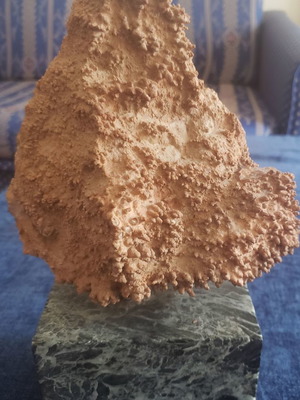 Natural raw mountain crystal used on large marble base