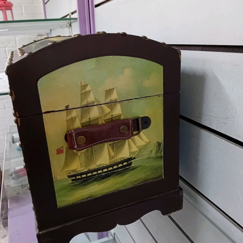 Small trunk used with ship decor and leather handles