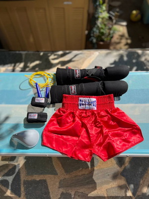 Kick Boxing Olympus set new with shin guards, shorts, wraps, groin guard, and jump rope