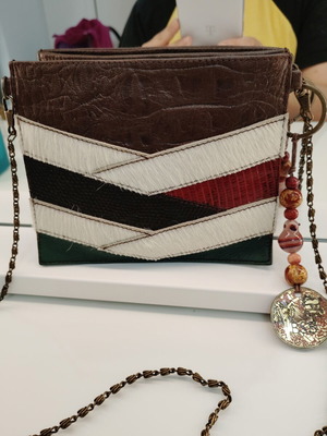 BSB leather crossbody bag with natural pony hair and decorative keychain
