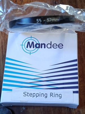 Stepping ring 55-52mm like new, lens filter adapter