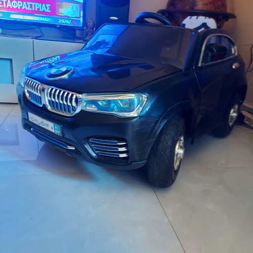 BMW X6 electric ride-on car like new with remote control and LED lights