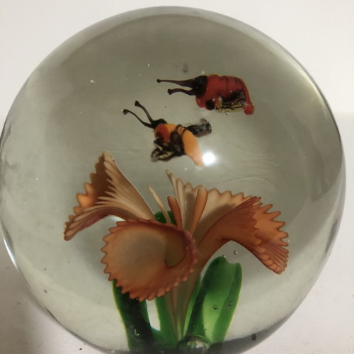 Handblown glass dome paperweight with stylized bees