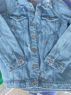 Girls jean jacket like new with pre-worn holes, size 152