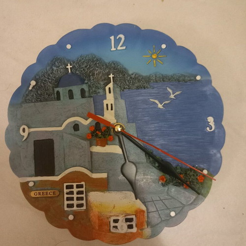 Wall clock like new with embossed island design and battery