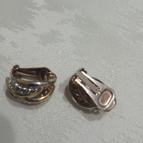 Ornate two-tone earrings used, gold and silver color