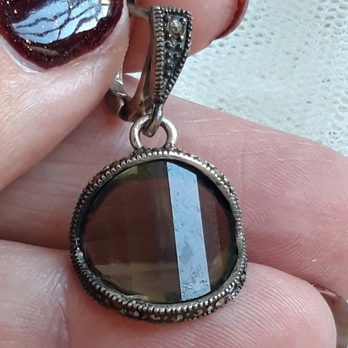 Silver set used with green transparent stones and marcasite