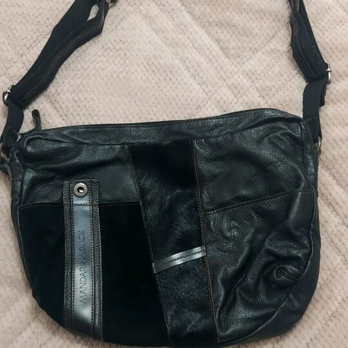 Mandarina Duck leather bag black like new with castor and pony skin