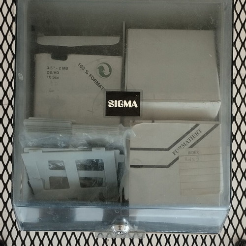 Sigma floppy disk case with computer disks