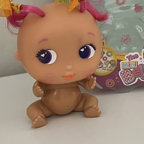 The Bellies Mini Yummy doll used, pink hair, orange bows