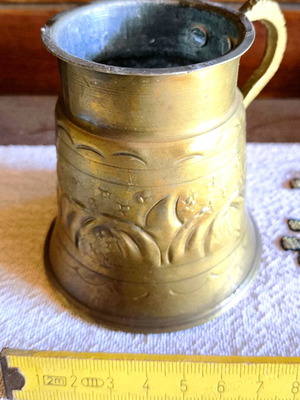 Vintage brass cup used with carved designs