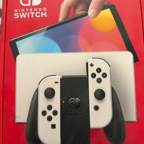Nintendo Switch OLED like new with accessories and two games