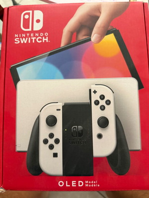 Nintendo Switch OLED like new with accessories and two games