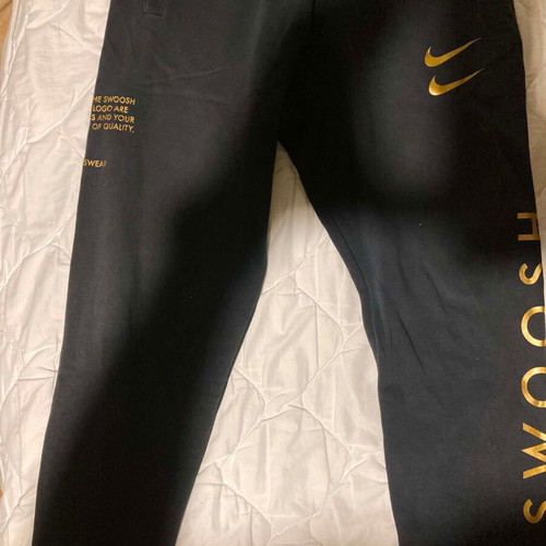 Nike Swoosh sweatpants used, size M, black with elastic cuffs