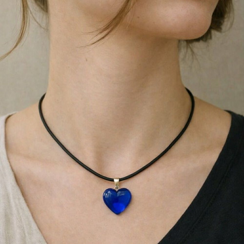 Necklace with dark blue heart on black cord like new