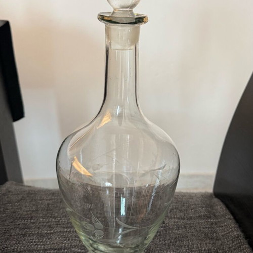 Vintage glass decanter like new with engraved decorative patterns