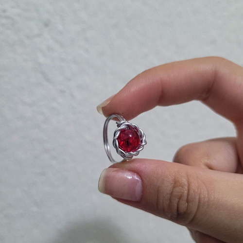 Fantasy wire ring like new with red crystal bead and silver wire