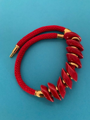 Vintage necklace red with smooth stone on red cord like new