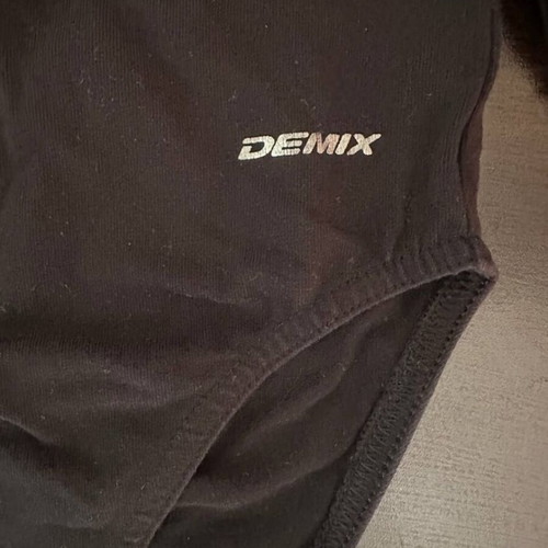 Demix black dance leotard with long sleeves and stars like new, size 128