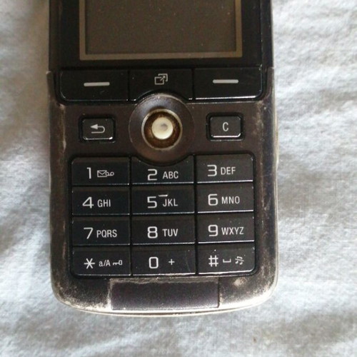 Sony Ericsson mobile phone used, missing back cover