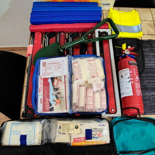 Car safety kit with fire extinguisher, triangles, first aid kits, shovel, vest