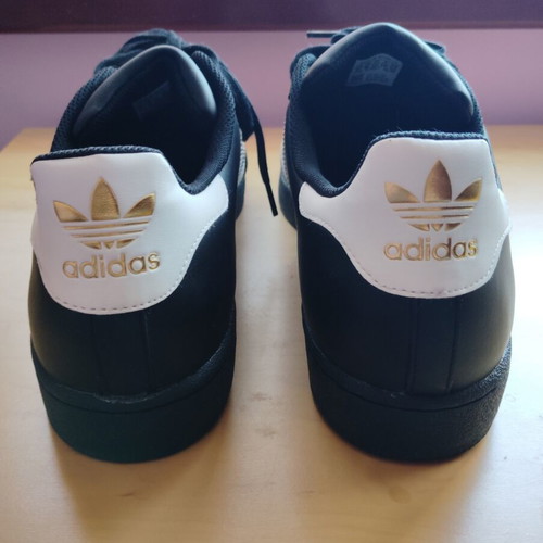 Adidas Superstar sneakers size 52.5, black and gold