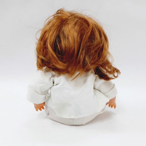 Vintage hard plastic doll with blue sleeping eyes, 1970s