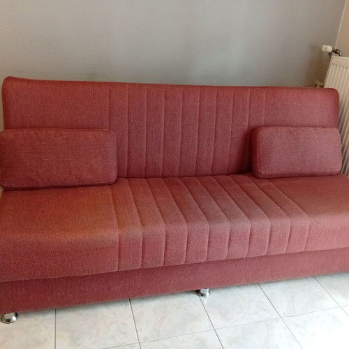 Three-seater sofa bed with storage space