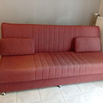 Three-seater sofa bed with storage space