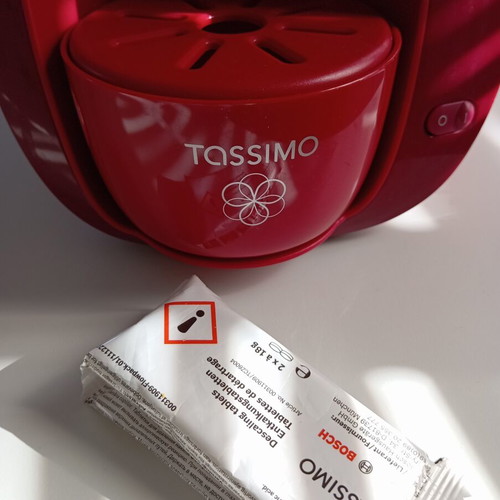 Tassimo Bosch coffee machine used, bordeaux color with descaling capsule
