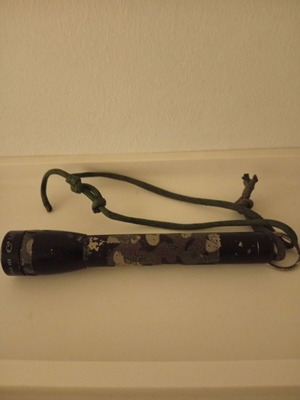 Maglite Mini flashlight used, camouflage military style