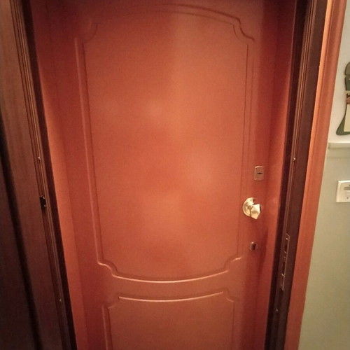 Lacquered entrance door used, terracotta exterior, white interior
