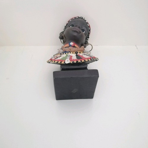 African figurine like new with intricate bead jewelry