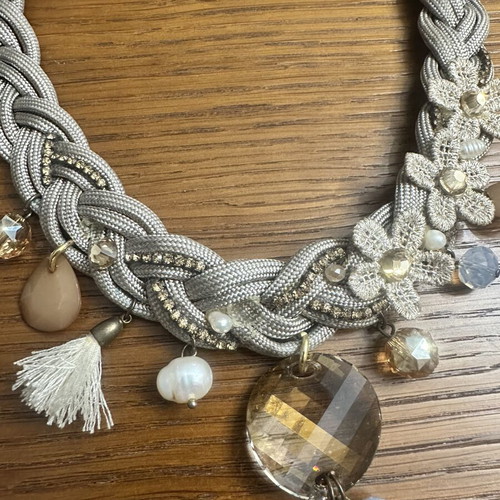 Handmade statement necklace with grey braided cord and fabric flowers