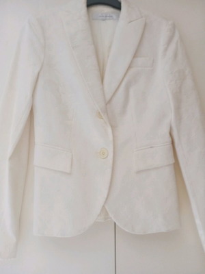 Jacket ecru with embossed patterns and two small back slits like new