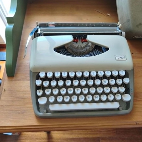 Olympia Traveller vintage typewriter with Greek keyboard and case used