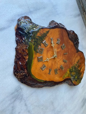 Handmade wooden wall clock from tree trunk.