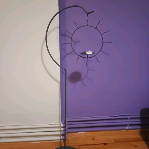 Handmade floor candlestick with hanging sun, like new, 1m height