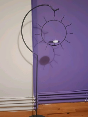 Handmade floor candlestick with hanging sun, like new, 1m height