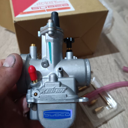 Carburetor 24mm new with extra needle, jet, neck, screws, and rubber mouth