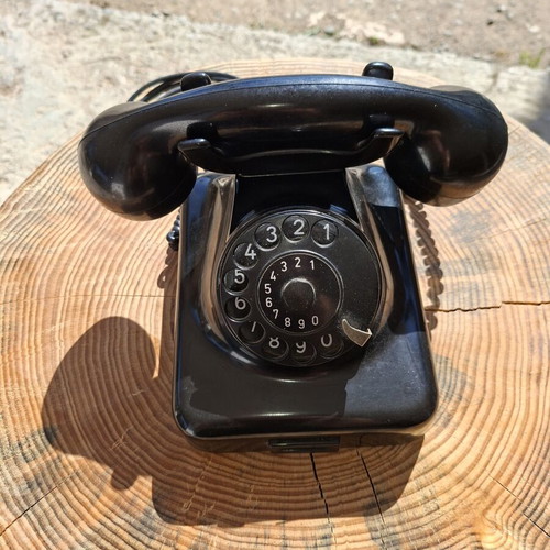 Collectible old-style telephone used, black, functional