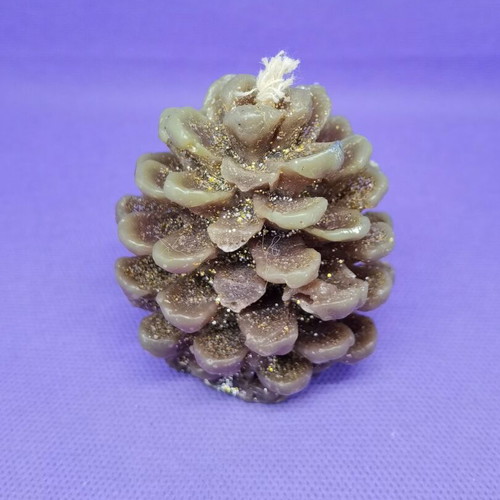Decorative candle in pine cone shape like new