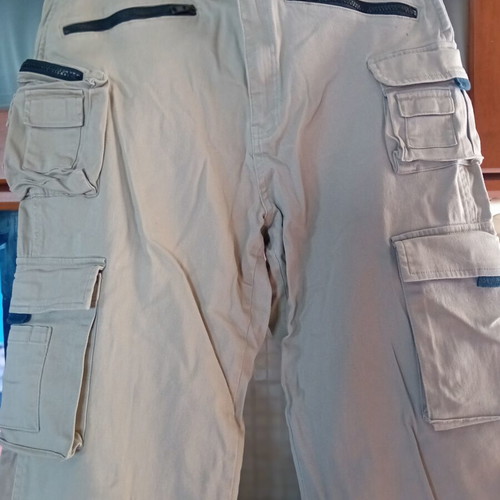 Timberland men's beige pants with 6 front and 2 back zip pockets, size 34