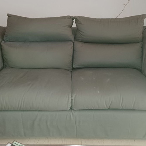 Two-seater sofa used, gray with purple-pink fabric on arms
