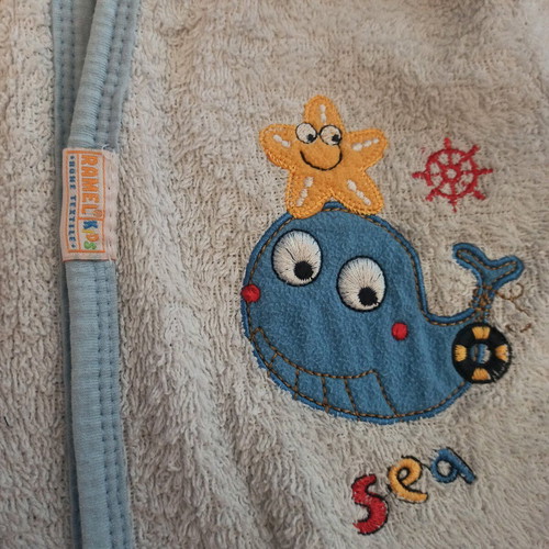 Baby bathrobe like new, white with blue details and belt
