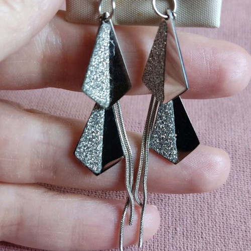 Steel earrings new in silver color